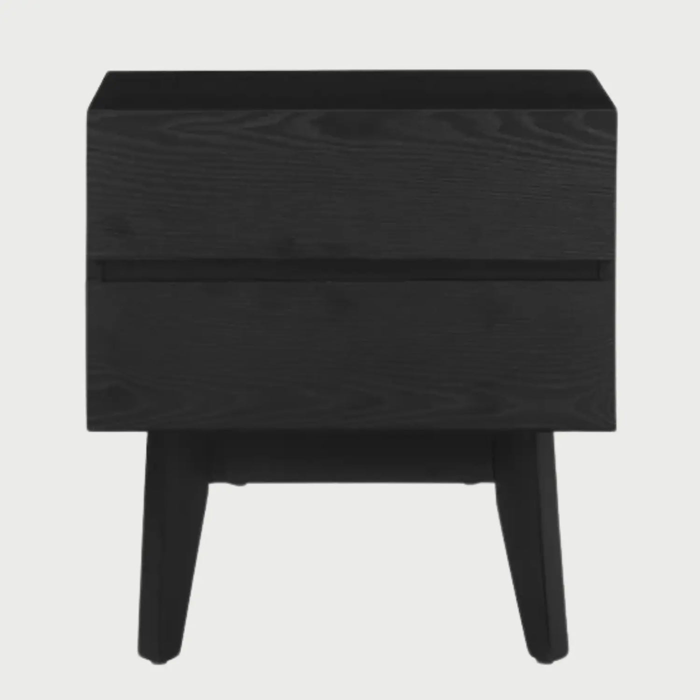 Vista frontal del buró Meztli B en color negro mate, con dos amplios cajones de frentes lisos y tiradores discretos sobre una base de patas de madera inclinadas.