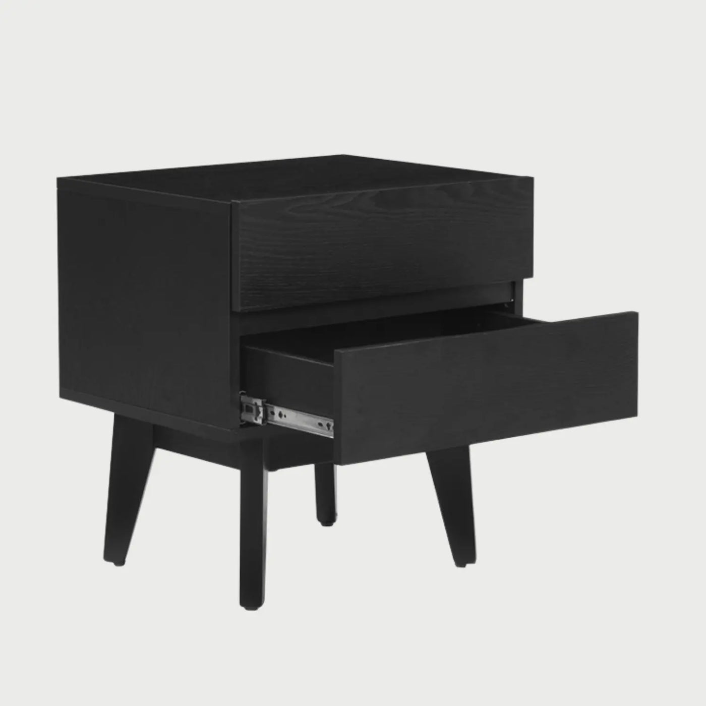 Vista lateral del buró Meztli B negro, mostrando el perfil compacto del mueble y la veta sutil de la madera en los costados que complementa su diseño moderno.