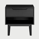 Vista frontal del buró Talitha en color negro mate, destacando la silueta moderna del tirador calado y el contraste visual del nicho abierto para decoración o libros.