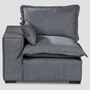 Vista frontal del módulo lateral izquierdo Emilia en color gris oscuro; el tono profundo resalta la suavidad de sus cojines de gran volumen y la estructura robusta del asiento, ideal para salas de estilo contemporáneo.