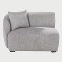 Módulo lateral con brazo izquierdo Kant GAIA tapizado en tela gris con silueta curva de diseño orgánico.