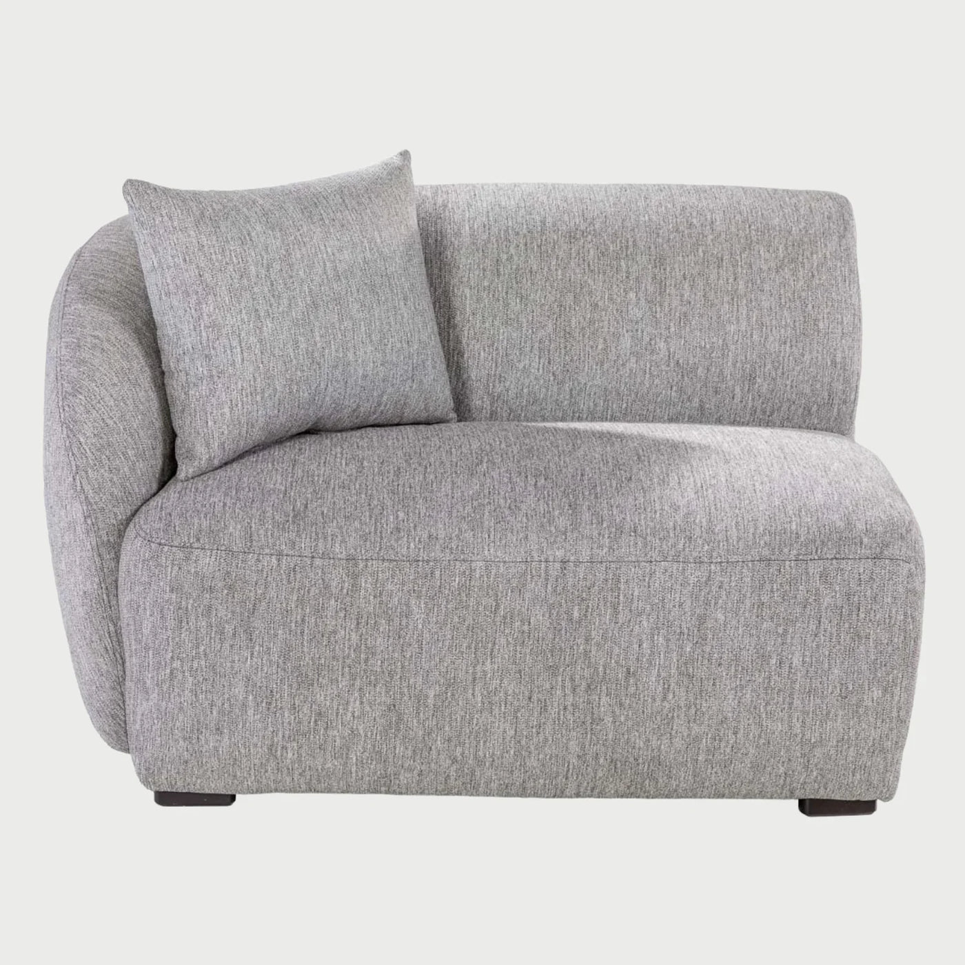 Módulo lateral con brazo izquierdo Kant GAIA tapizado en tela gris con silueta curva de diseño orgánico.