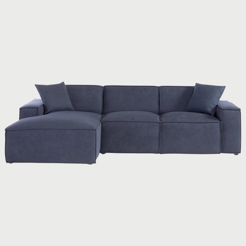 Sofá esquinero izquierdo Otto con diseño moderno y tapizado en azul oscuro, ideal para relajarse y decorar tu hogar.