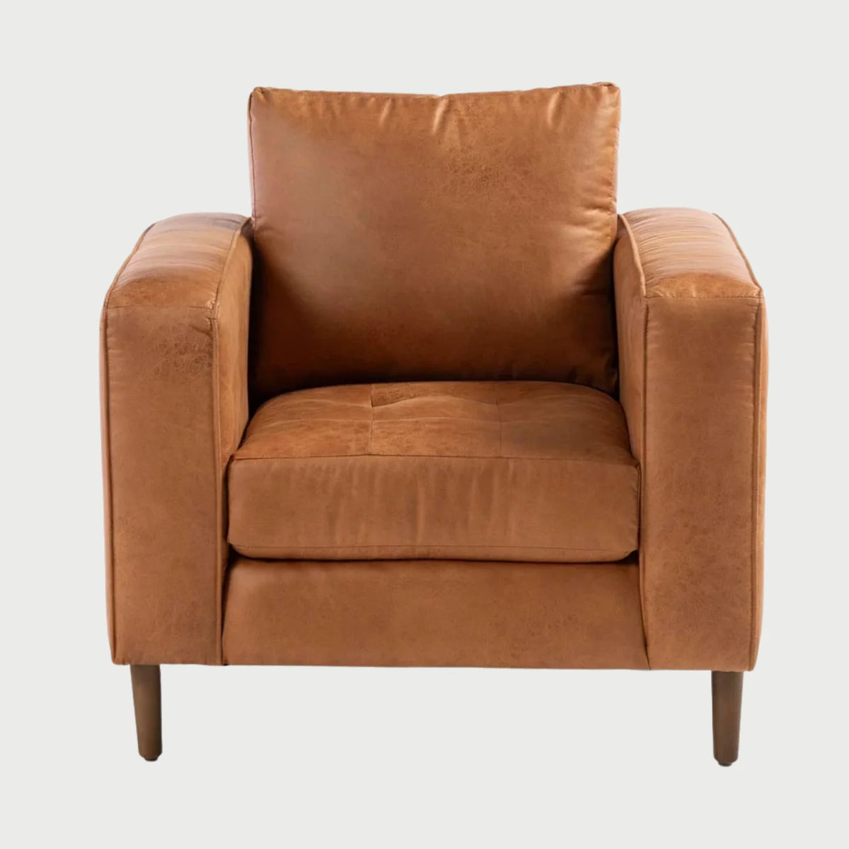 Sillón Landero en color marrón, con un diseño cuadrado, amplios reposabrazos y cojines suaves para mayor confort.