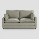 Vista frontal del sofá Andrea de dos cuerpos en color blanco, destacando su apariencia luminosa y el confort de sus cojines acolchados de gran formato.