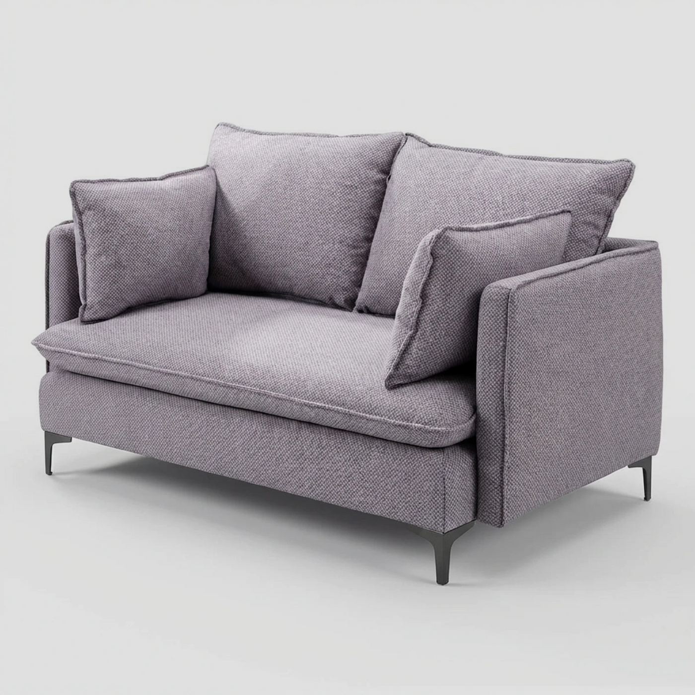 Vista lateral del sofá Cecil gris, resaltando el perfil delgado de sus brazos rectos que contrastan con la profundidad y suavidad de los cojines de asiento y respaldo.