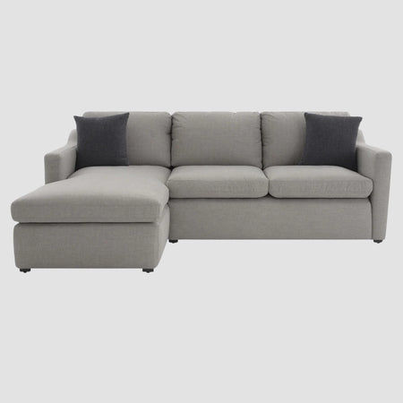 Sofá esquinero izquierdo Marie GAIA tapizado en tela gris con cojines de contraste para sala moderna