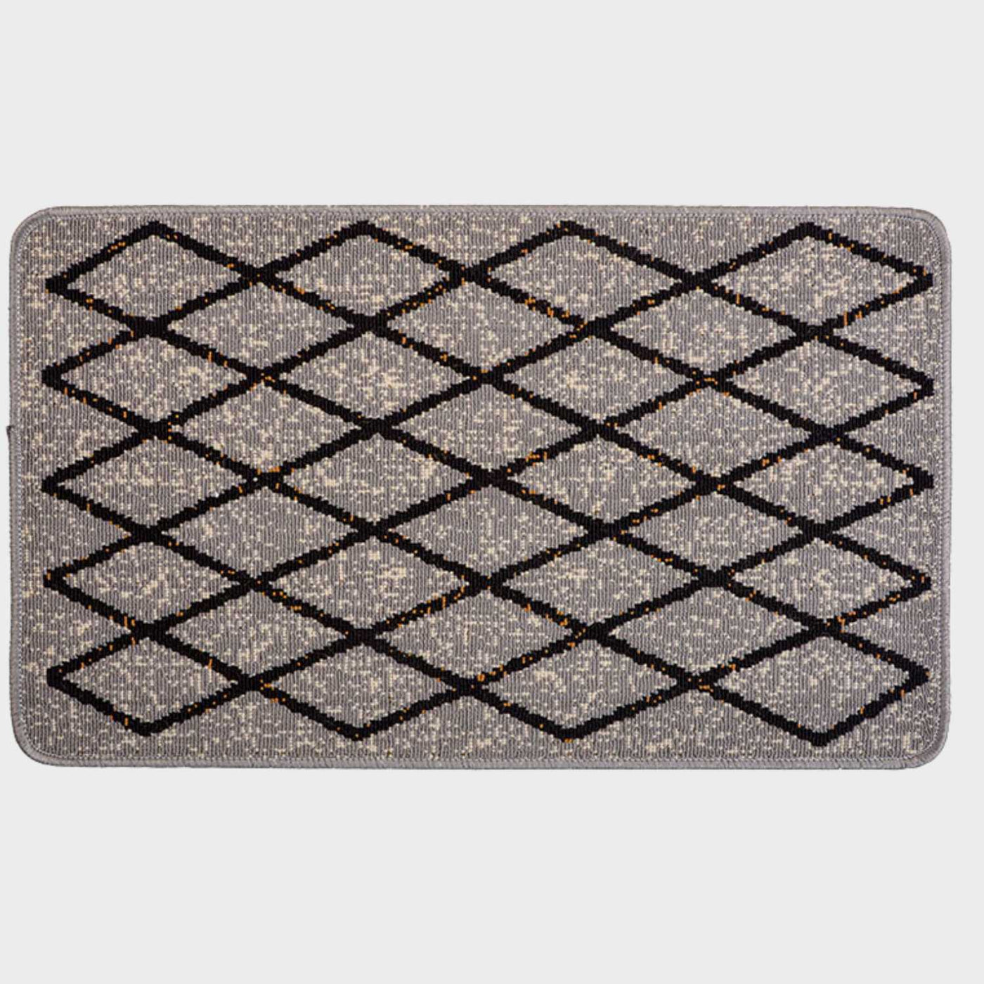 Vista completa del tapete de entrada Mabel con patrón geométrico tipo rombos en negro