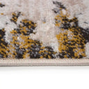 Tapete Sirku con un diseño abstracto en tonos beige, marrón y mostaza, con bordes acabados en un tono claro. Ideal para decorar tu espacio.