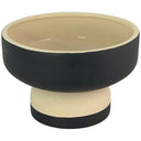 Maceta redonda de dos tonos, con exterior negro y base más clara, ideal para decorar cualquier espacio.