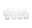Set de 12 tequileros de vidrio transparente con diseño texturizado, perfectos para disfrutar de tu tequila favorito.