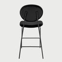 Vista posterior del banco alto Pisa en color negro, exhibiendo el diseño limpio del respaldo circular y la continuidad estética de la estructura metálica oscura.