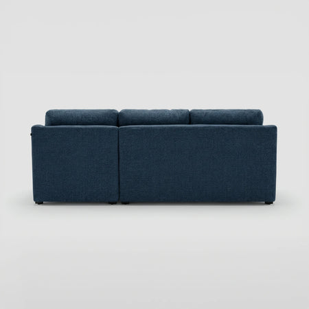 Vista posterior de la esquinera derecha Marie azul, resaltando el acabado liso del respaldo y la estructura uniforme que permite su uso como separador de ambientes.