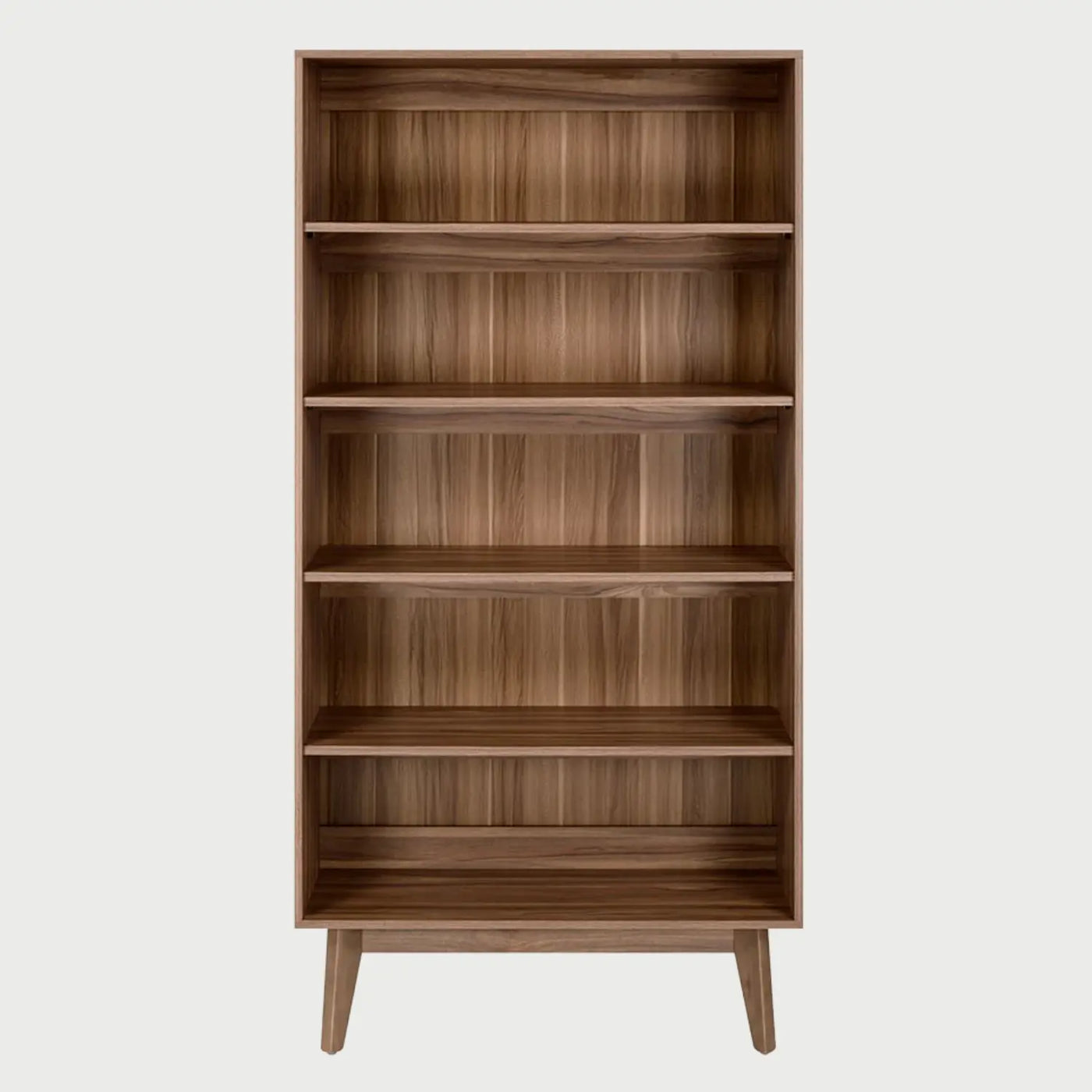 Vista frontal del librero Meztli en tono café; se aprecia la veta natural de la madera en sus compartimentos y el diseño minimalista de apertura mediante orificios circulares.