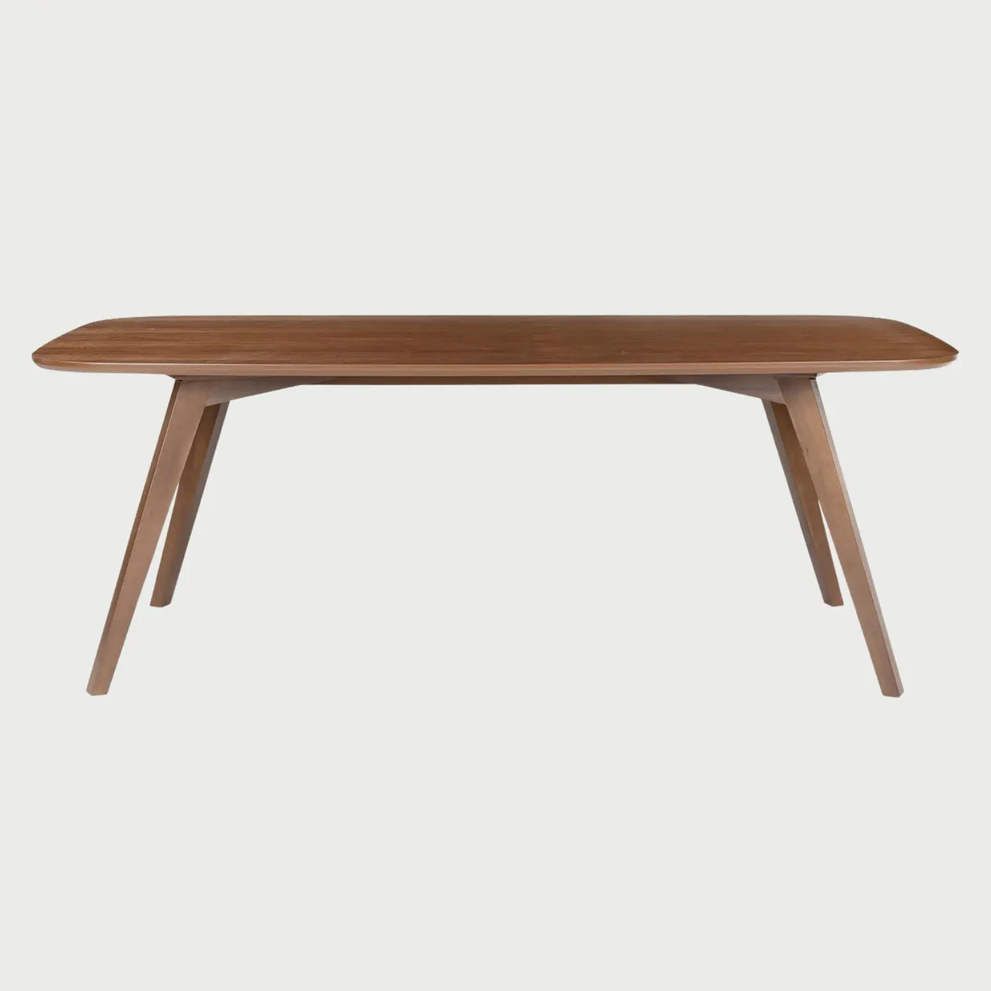Vista frontal de la mesa de comedor Talitha de 200 cm en color café nogal; presenta una superficie rectangular con esquinas suavemente redondeadas y una base de cuatro patas angulares que se abren hacia afuera en un diseño moderno de mediados de siglo.