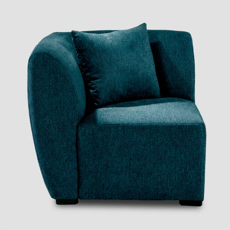 Vista de perfil del módulo esquinero Kant en color azul, resaltando la profundidad de la pieza y su estructura modular de líneas limpias.