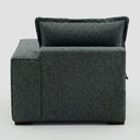 Vista trasera del módulo individual derecho Emilia en gris oscuro, mostrando el acabado impecable del tejido que garantiza elegancia desde cualquier ángulo.