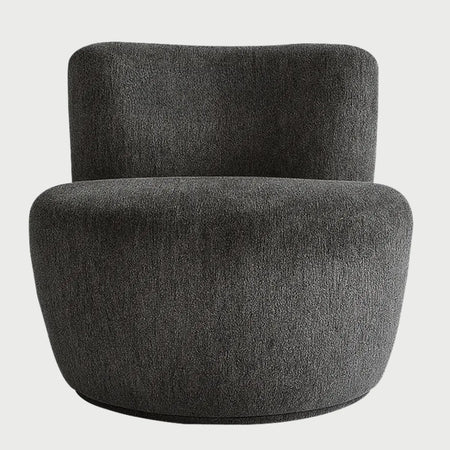 Sillón Sam GAIA en tela gris de silueta circular minimalista para interiores modernos.