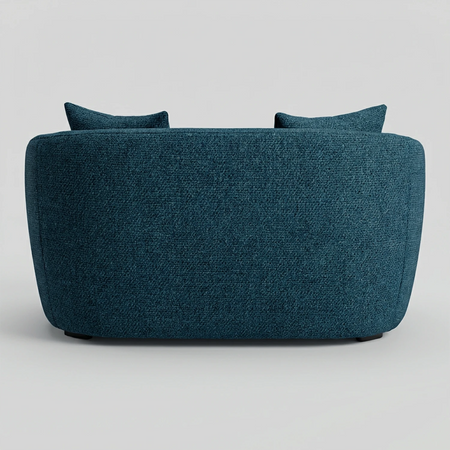 Vista posterior del sillón XL Kant en color azul, destacando el tapizado integral y las líneas suaves de su estructura que permiten una estética limpia desde cualquier ángulo.