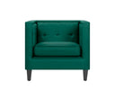 Sillón Moncayo tapizado en terciopelo verde esmeralda, con respaldo acolchado y patas de madera oscura, ideal para cualquier sala.