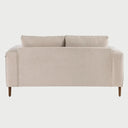 Vista posterior del sofá Landero GAIA de 3 cuerpos tapizado en tela beige, resaltando el acabado uniforme del respaldo y la estructura de madera sólida en la base.