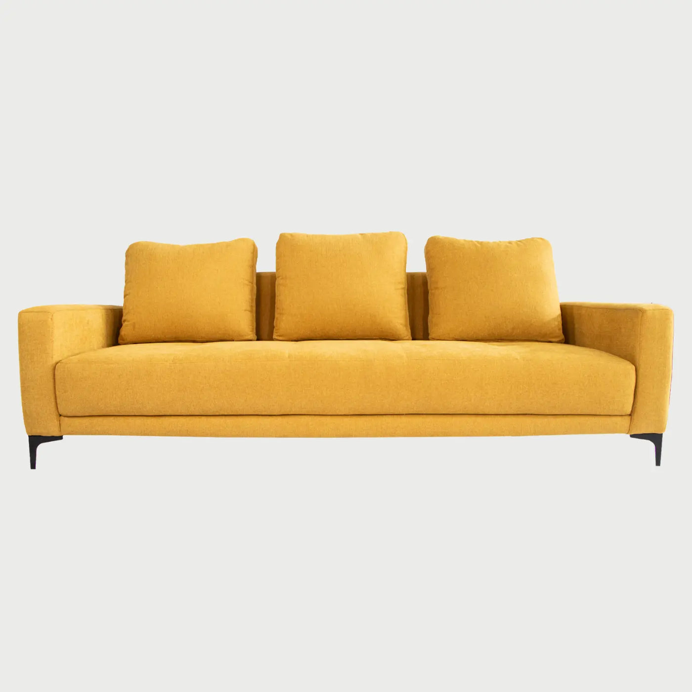 Vista frontal del sofá cama Arriaga en color amarillo vibrante, diseñado como pieza de acento para interiores dinámicos.
