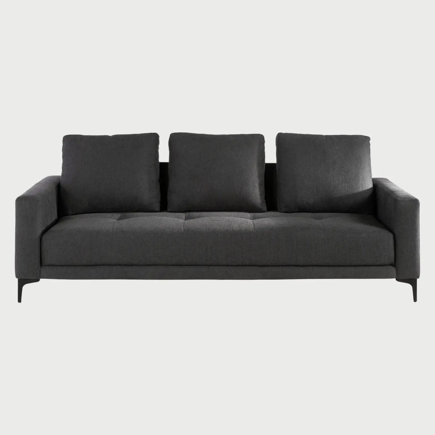 Frente del sofá cama Arriaga en tono gris obscuro (charcoal), ofreciendo un look sobrio y contemporáneo.