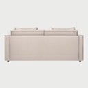 Vista posterior del sofá cama Teuhtli en color beige, con un acabado tapizado liso y uniforme que permite colocar la pieza como separador de espacios en salas abiertas.