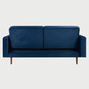 Vista posterior del sofá cama Viga en color azul, con un acabado tapizado completo que permite su lucimiento desde cualquier ángulo de la habitación.