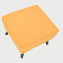 Vista posterior del taburete San Blas en amarillo, con un acabado tapizado uniforme en todas sus caras, ideal para complementar cualquier rincón de la sala.