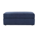 Taburete Amil en color azul, con diseño rectangular y superficie suave, ideal para cualquier espacio moderno.