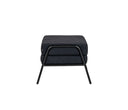 Taburete Tuxama con patas de madera negras, diseño moderno y compacto, ideal para cualquier ambiente del hogar.